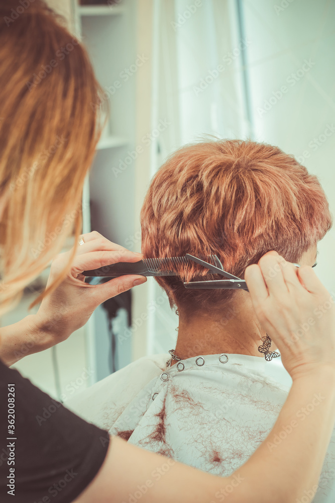 Fototapeta premium Woman brushing her hair