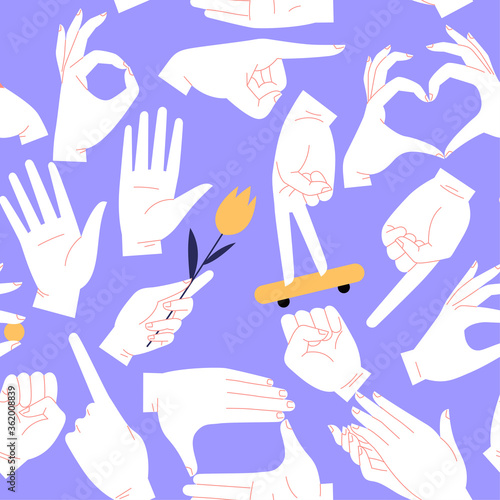 Seamless pattern of different hand gestures on a purple background