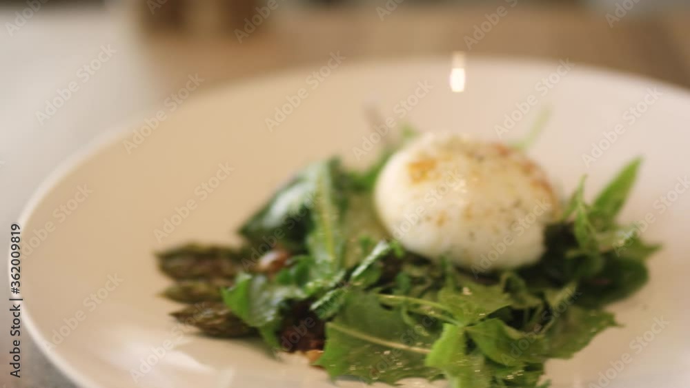 Salad with cheese on a white plate in a luxury hotel Salad with cheese on a white plate in a luxury hotel