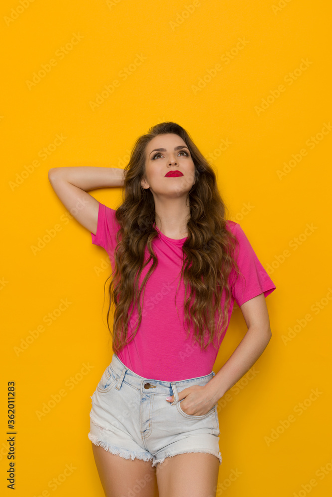 Young Woman In Pink T-Shirt Is Looking Up And Dreaming Young Woman In Pink T-Shirt Is Looking Up And Dreaming