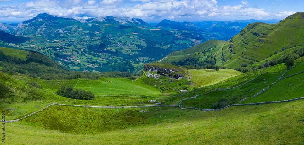 Landscape from a drone in Portillo de la Sia. Mowing meadows, pasiegas cabins and beech forests. Community of Cantabria. Spain.Europe