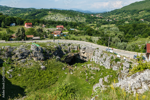 God’s bridge ( Podul lui Dumnezeu ) - natural rock bridge formed by a collapsed cave on june 29, 2020 in Ponoarele. The monument is visited daily by many tourists. photo