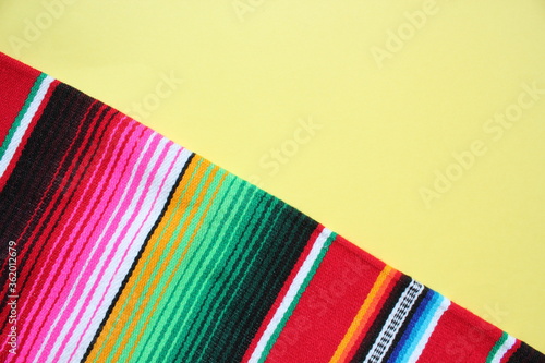 poncho Mexican cinco de mayo rug serape fiesta traditional Mexico background with stripes copy space maya blanket minimal simple -  stock, photo, photograph, image, picture 