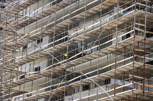 Photo of multistory high rise building with scaffolding © דרור להט