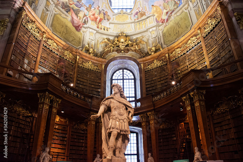 The Prunksaal statue center of the old imperial library for Austrians people and foreign travelers travel visit at State Hall of Austrian National Library on September 24, 2019 in Vienna, Austria photo