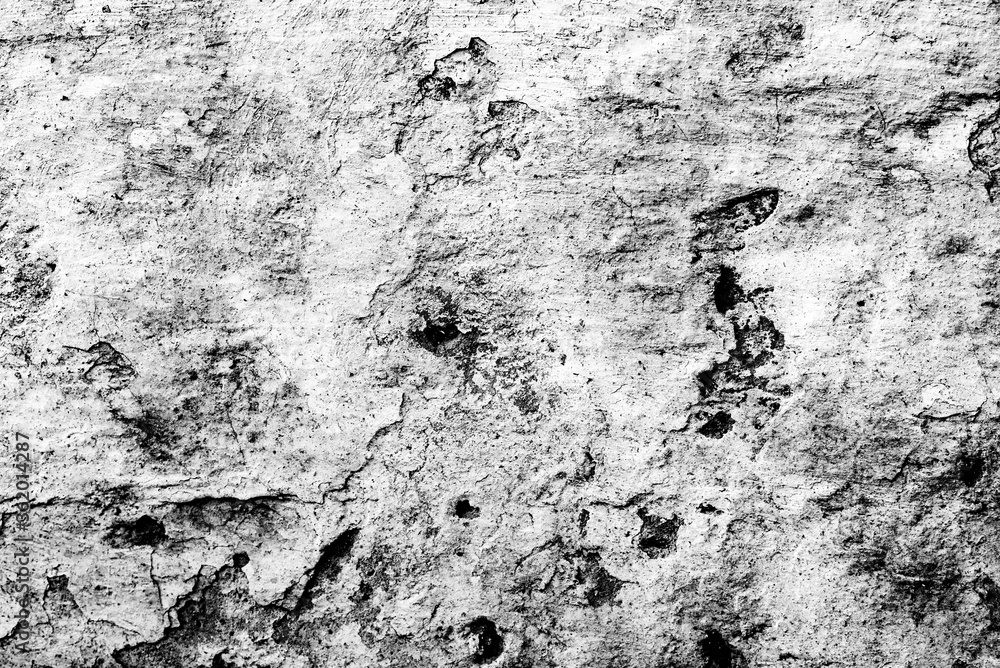 Fototapeta premium Texture of a concrete wall with cracks and scratches which can be used as a background
