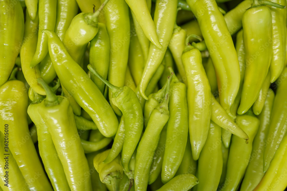 Bunch of organic green fresh sweet pepper on a market, background Bunch of organic green fresh sweet pepper on a market, background
