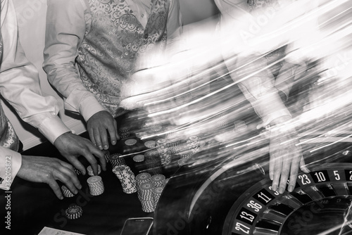 Bkack and white photo gambling, casino roulette, bet on black in las vegas. white ball.