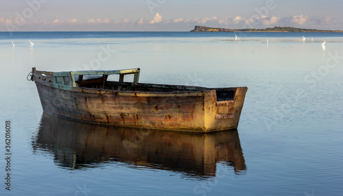 water  sea  reflection  beach  ship  travel  pier  harbor  sky  fishing boat  fisherman  sunset  lake  horizontal  color image  nautical vessel  waterfront  no people  water s edge  transportation  