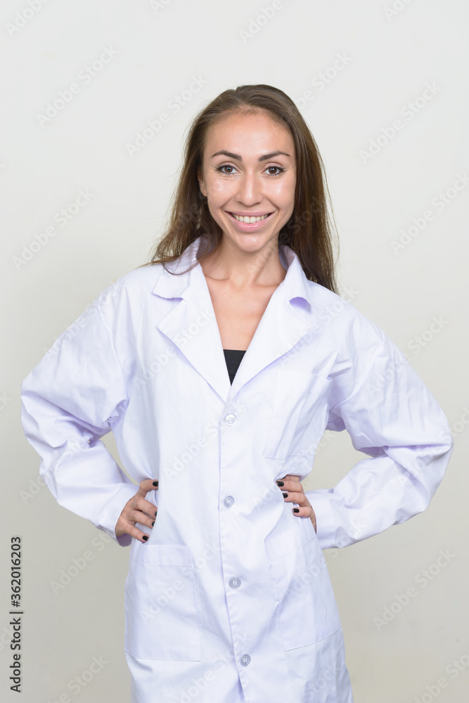 Portrait of happy young woman doctor with brown hair smiling Portrait of happy young woman doctor with brown hair smiling