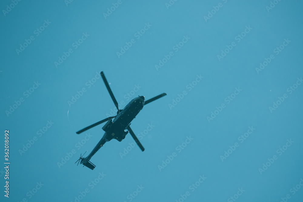 big helicopter flies in the blue sky big helicopter flies in the blue sky