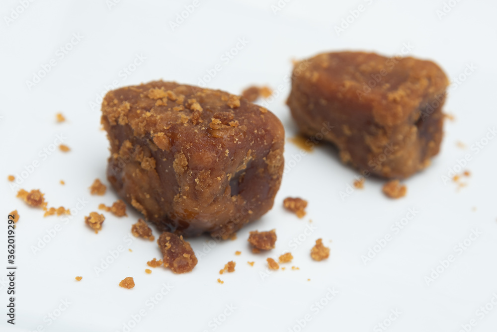 palm jaggery Indian organic Gur with Sugar Cane natural sweeteners cane syrup. Brown palm sugar. Nolen Gur, or Date palm jaggery