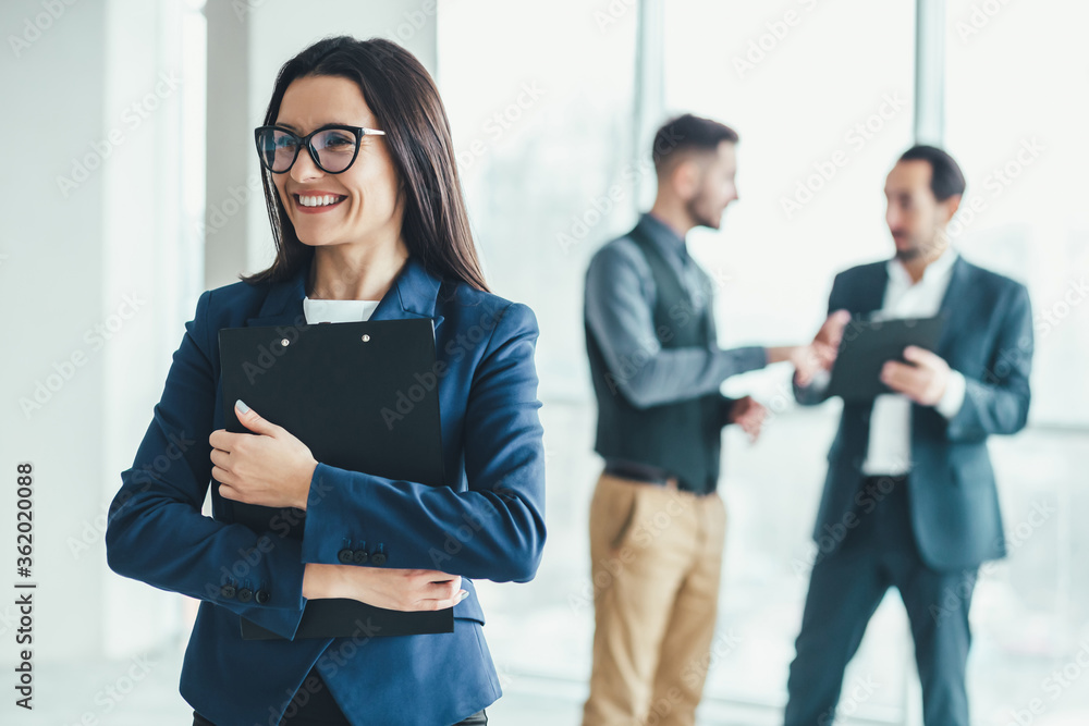 Business people analysing risks for their business in office environment. Business people analysing risks for their business in office environment.
