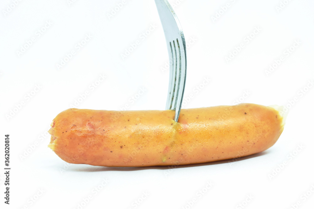 fried pork sausage stabbing by silver fork on white background fried pork sausage stabbing by silver fork on white background