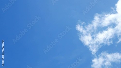 moving beautiful white cloud with blue sky background at day time