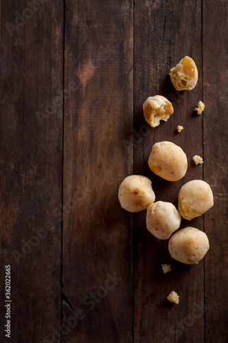 Cheese bread with bran on wooden table top view