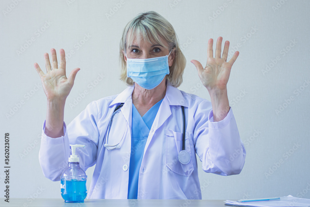 Caucasian doctor wearing mask and wash her hands. Caucasian doctor wearing mask and wash her hands.