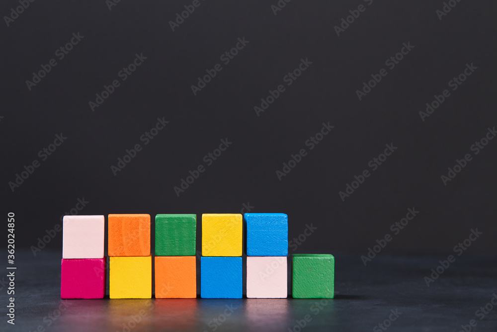 Colourful cubes for inscription on dark background, place for text Colourful cubes for inscription on dark background, place for text