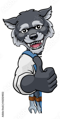 A wolf cartoon animal mascot mechanic, carpenter, handyman or builder construction worker peeking around a sign and giving a thumbs up
