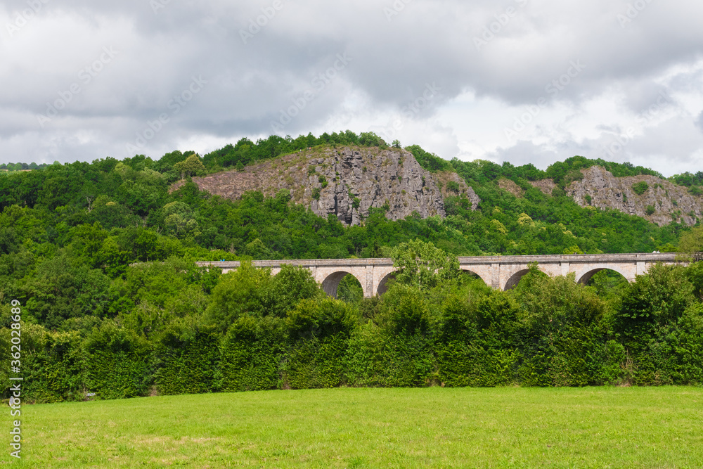 custom made wallpaper toronto digitalBeautiful landscape photography of Clecy in Norman Switzerland (Calvados, Normandy, France, Europe). Former railroad station (stone viaduct). Luxurious nature & cliffs.