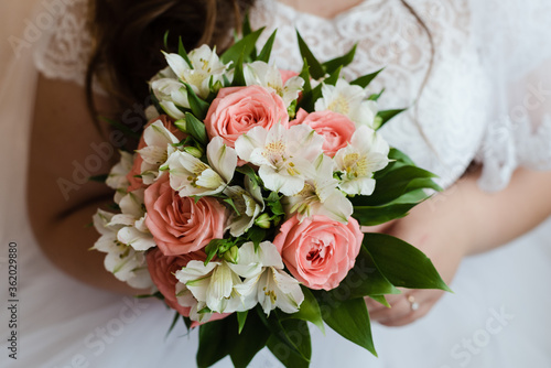the bride's bouquet, bride holds a bouquet, bouquet of roses, wedding day, bride in a wedding dress, pink roses