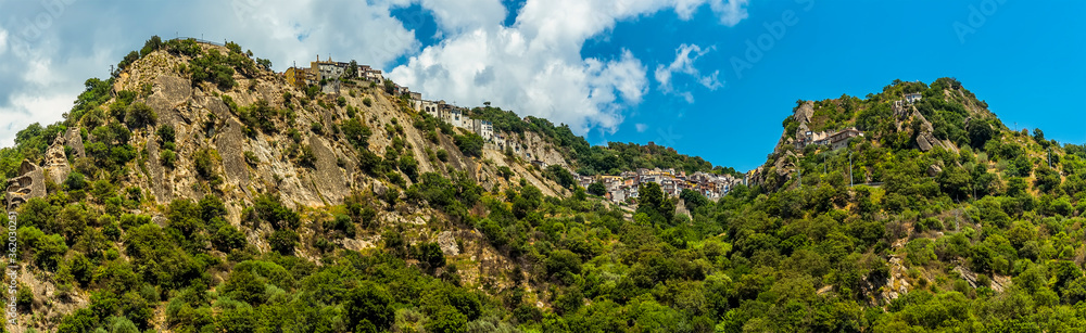 The settlement of Motta Camastra, Sicily perched on hill tops in the foot hills of Mount Etna near Taormina, Sicily in summer