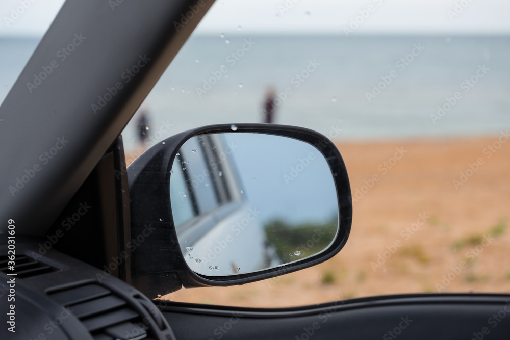 view outside from a car over a mirror