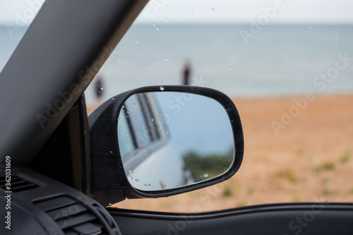 view outside from a car over a mirror © Yuriy Kulik