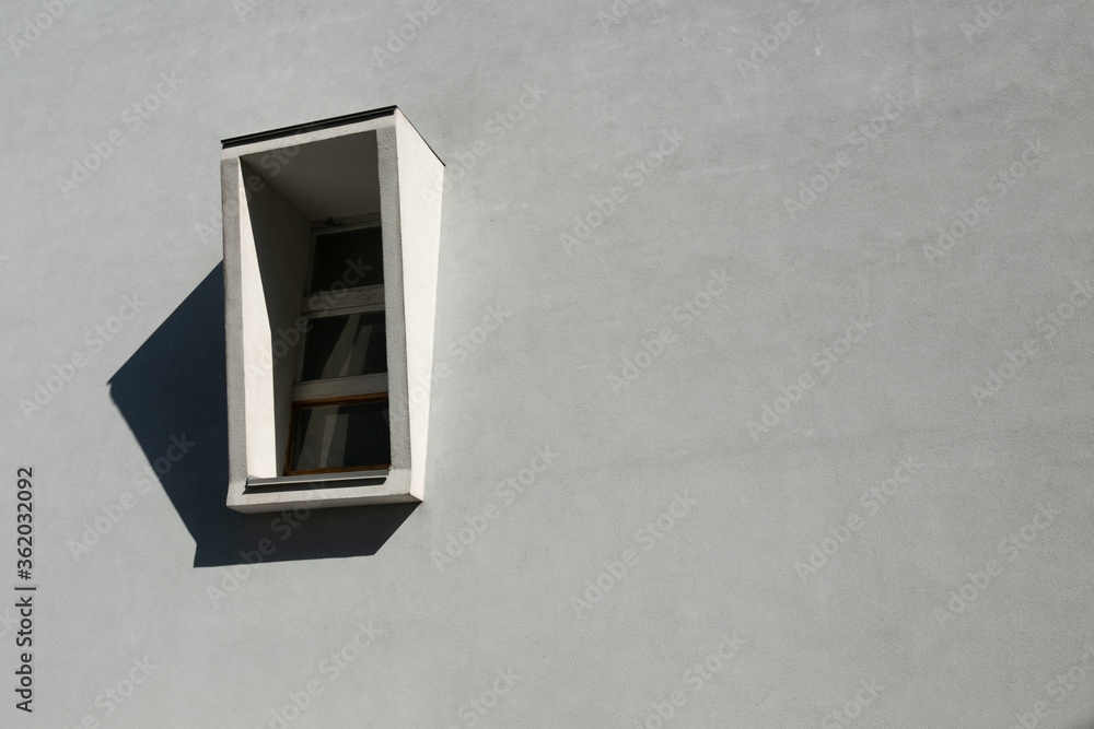 window on a white wall with a visor and shadow window on a white wall with a visor and shadow