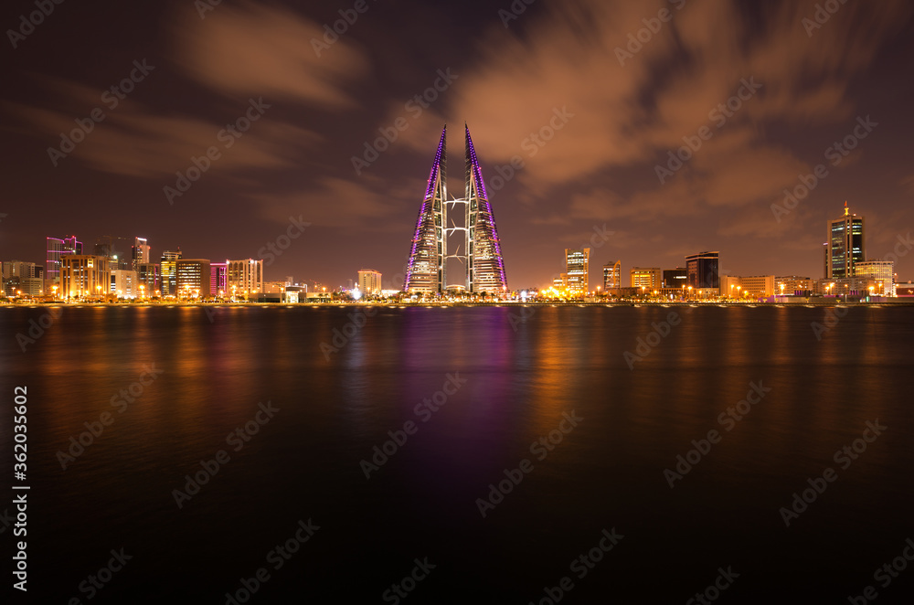 MANAMA, BAHRAIN - OCTOBER 28: The Bahrain World Trade Center during dusk, a twin tower complex is the first skyscraper in the world to have wind turbines, October 28, 2018, Manama, Bahrain