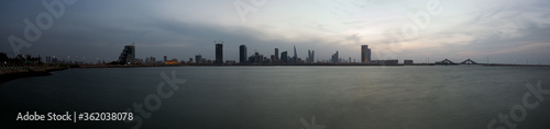  A panoramic view of Bahrain skyline at dusk with dramatic cloud