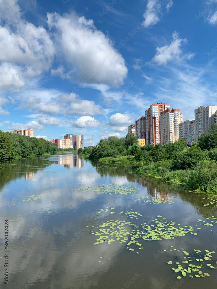 Russia, Moscow region, the city of Balashikha. Pekhorka river in summer sunny day and  view of Zarechnaya street