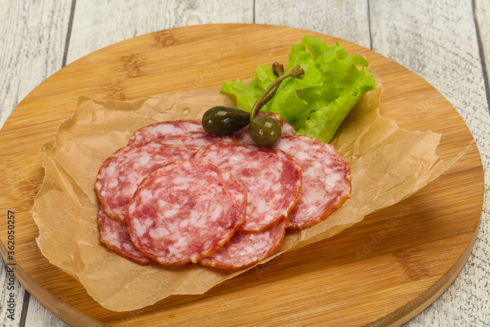 Spanish Salchichon sausage with salad Spanish Salchichon sausage with salad