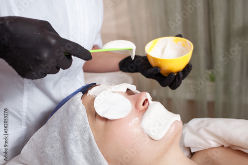 The beautician makes an alginite mask in the beauty salon. The composition includes brown algae, living at the bottom of the sea. Moisturizing, lifting, combats dryness, wrinkles