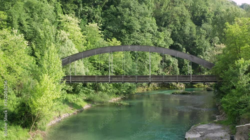 Aerial view of Serio river and old bridge, clean and green water,Seriana valley near Bergamo,Italy. Aerial view of Serio river and old bridge, clean and green water,Seriana valley near Bergamo,Italy.