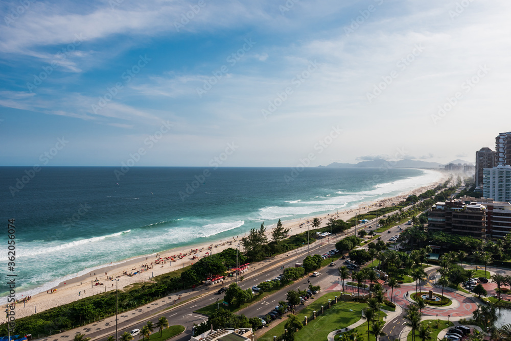 Aerial view of Copacana beach from a near building. Sunny and colorful day. Clean sea with a lot of people at the beach