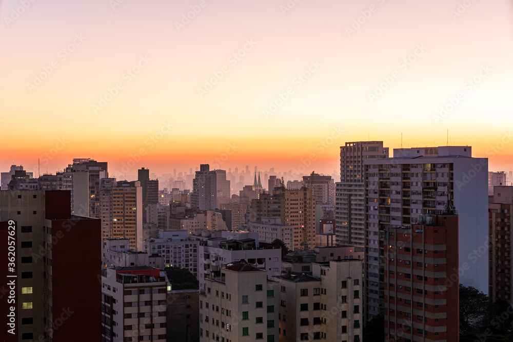 São Paulo city at twilight. Consolação avenue with urban red and yellow lights. Long exposure shot with car trails. Look from above. Night and dark city. São Paulo city at twilight. Consolação avenue with urban red and yellow lights. Long exposure shot with car trails. Look from above. Night and dark city.