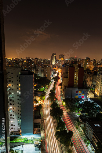 São Paulo city at night. Consolação avenue with urban red and yellow lights. Long exposure shot with car trails. Look from above. Night and dark city.