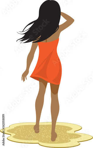 Long-haired woman on sandy beach stares into the distance with her back to the viewer