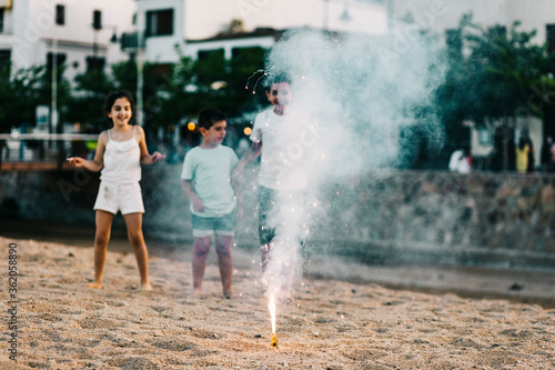 Group of kids looking fireworks photo