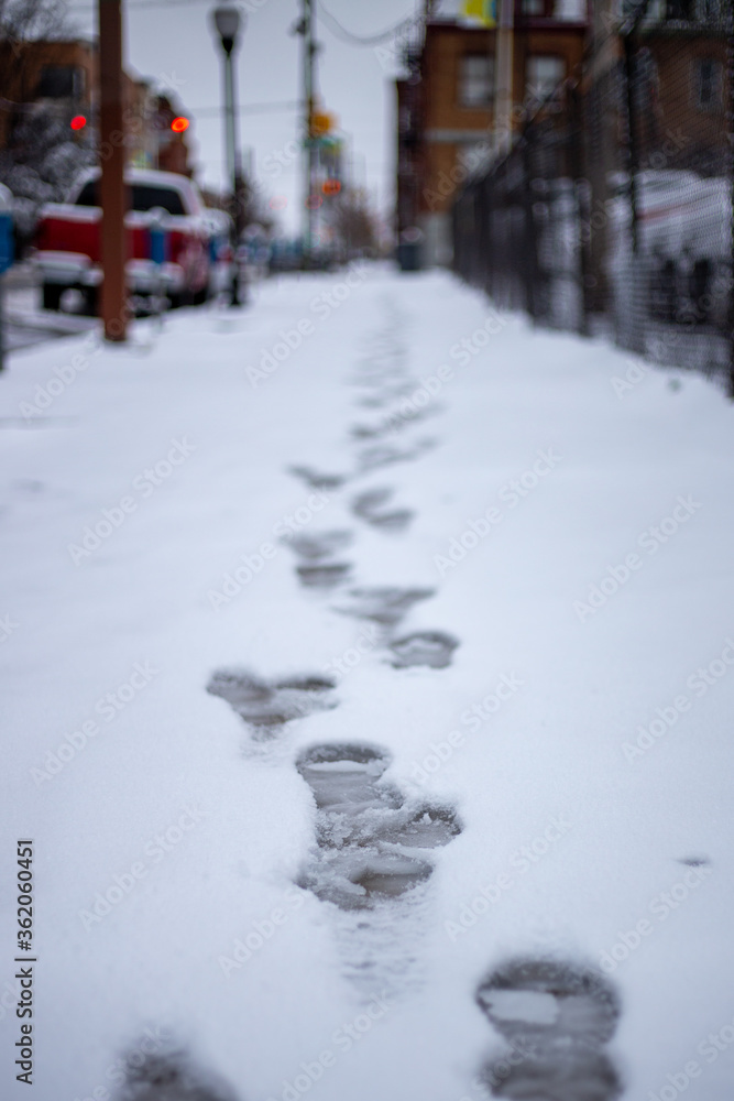 Footsteps in the snow in the city