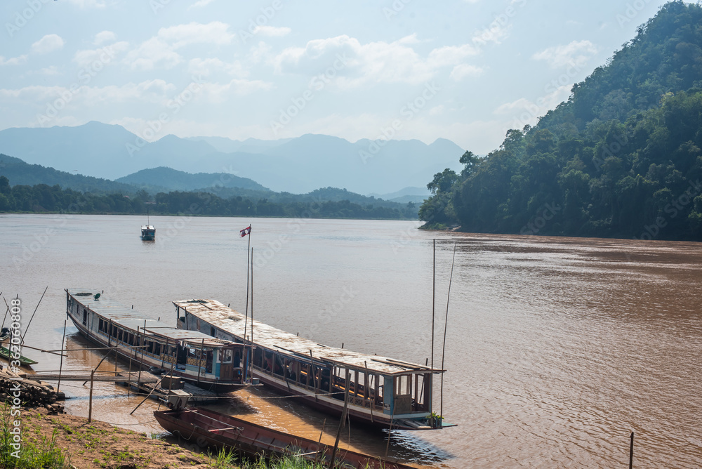sailing on a brown, muddy Mekong River