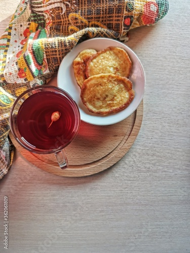 Russian national dish - pancakes and compote for breakfast