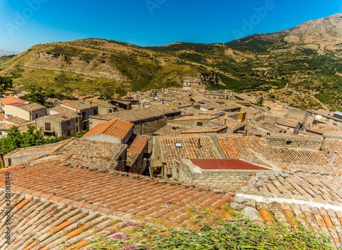 The rooftops of Petralia Sottana stretching towards the Mother Church in the Madonie Mountains, Sicily during summertime photo