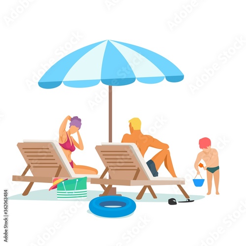 Family sitting on sun loungers under umbrellas at the beach. child playing in the sand