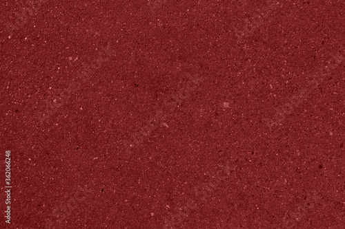 The texture of red cardboard. The texture of red paper. Shiny red surface with space for text and design.