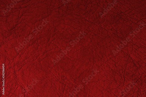 The texture of red leather. Red leather with folds for text and design.