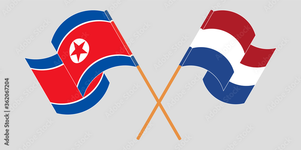 Crossed and waving flags of North Korea and the Netherlands Crossed and waving flags of North Korea and the Netherlands