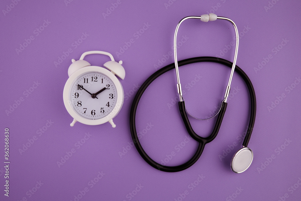 Time is important in life concept. Stethoscope kit and alarm clock. Time is important in life concept. Stethoscope kit and alarm clock.
