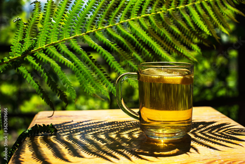 Wallpaper Mural a cup of tea with lemon on the table in summer Torontodigital.ca